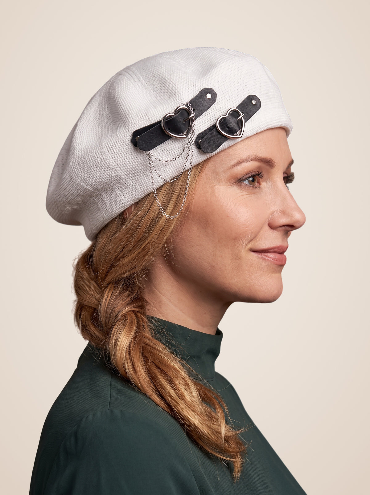 Double Heart Buckle Chain Beret in White, worn by a model, three quarter view