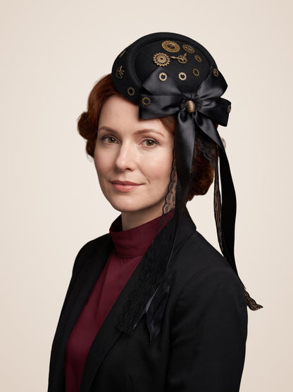 Clockwork Gear Cluster Bow Mini Top Hat in Black, worn by a model