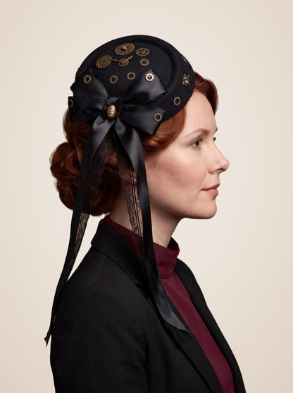 Clockwork Gear Cluster Bow Mini Top Hat in Black, worn by a model, side profile